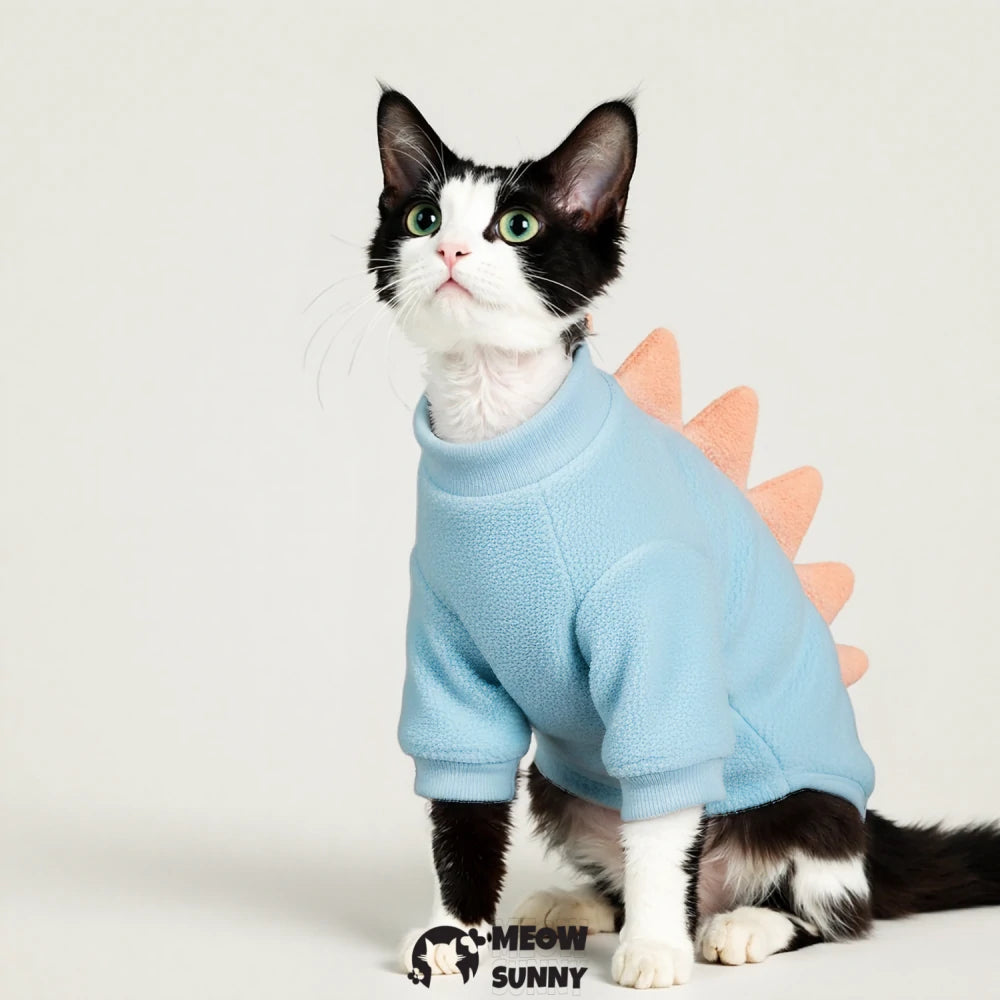 Pet cat clothes, suitable for outdoor walks, featuring a cartoon dinosaur design and a harness.